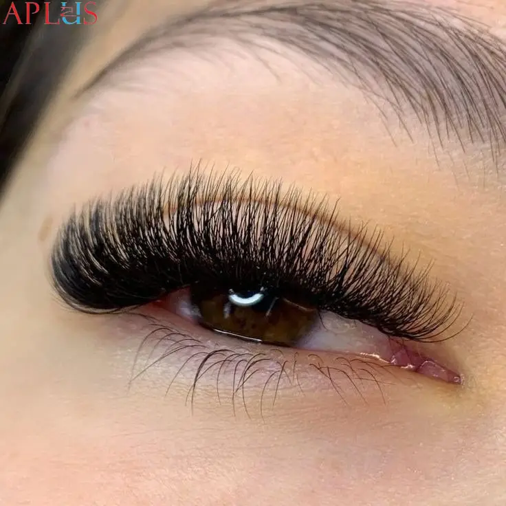 An eye with Mega Volume lashes, creating a dense and fluffy lash effect